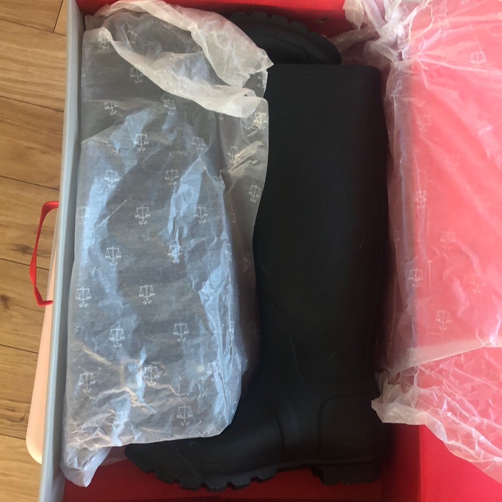 Black tall hunter boots